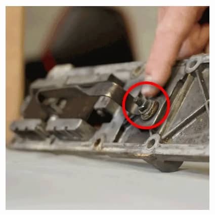 Image shows a picture of the Dodge Cummins 6.7L Liter air intake's stock grid heater stud and nut which over time can come loose and drop into the number 6 cylinder and cause engine damage or failure; prevent failure and engine damage with the Banks Monster-Ram intake heater upgrade.